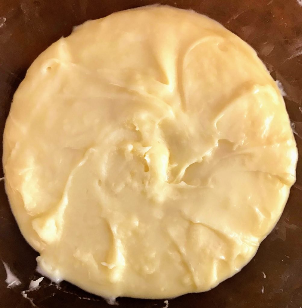 Smooth out the surface of the custard, cover, and let it cool.