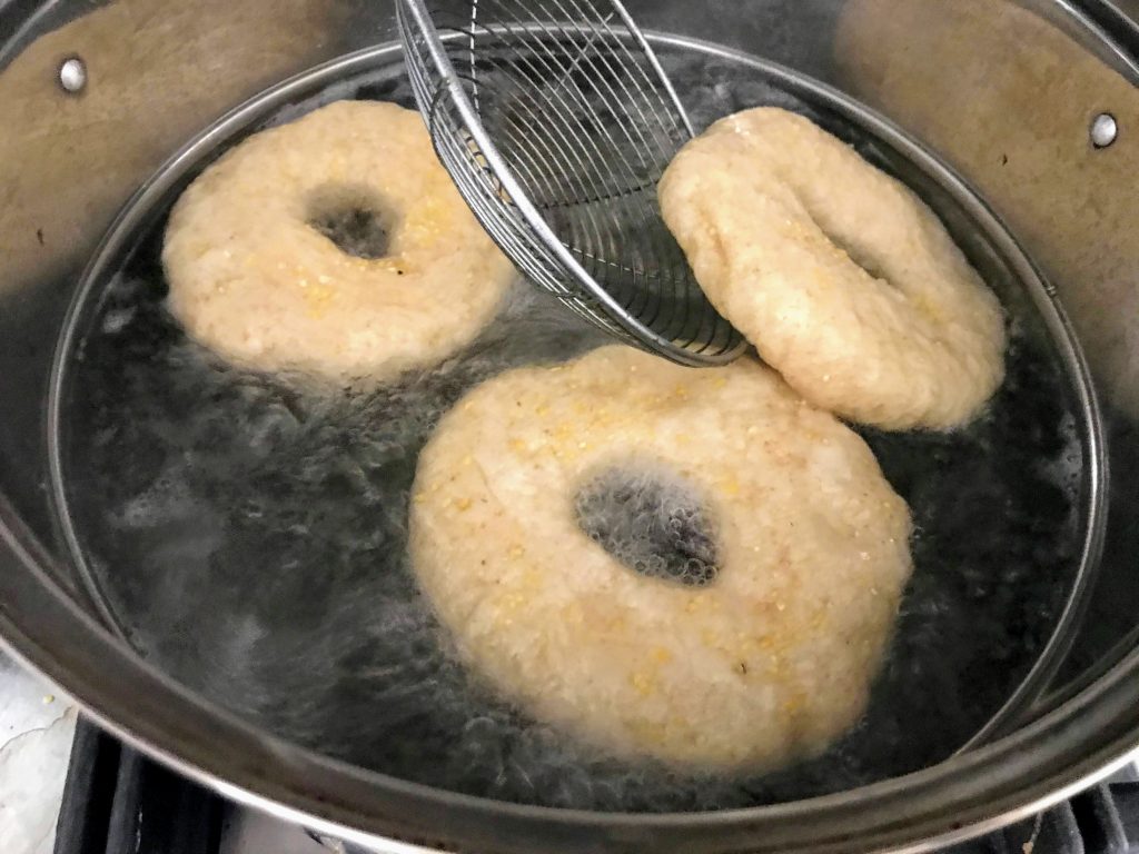 Sourdough bagels in hot water bath